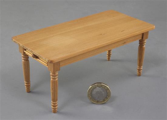 Denis Hillman. A Victorian style miniature kitchen dining table, the top 5.5in. x 2 7/8in.